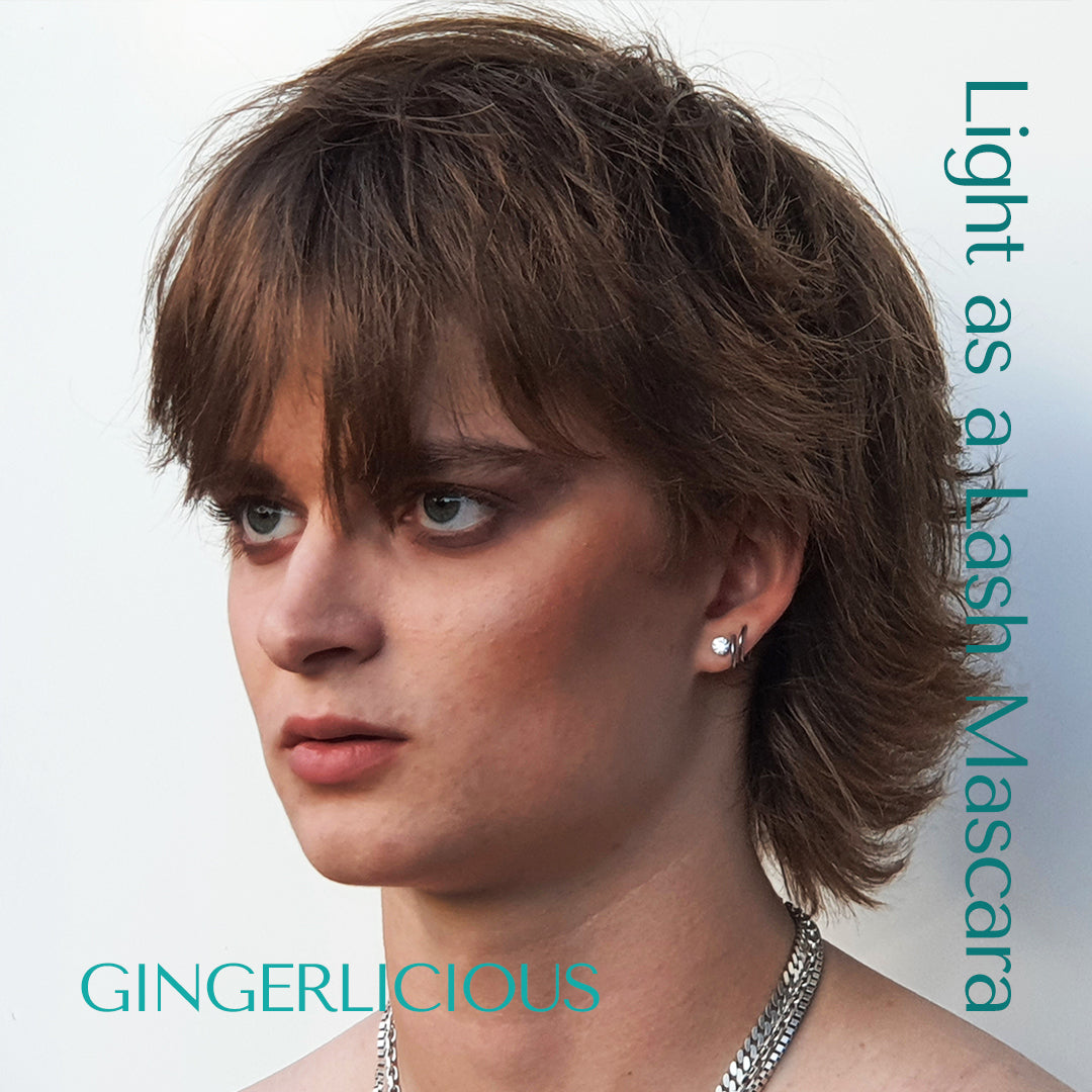 Dark Blond male model wearing light as a lash mascara in the shade Gingerlicious