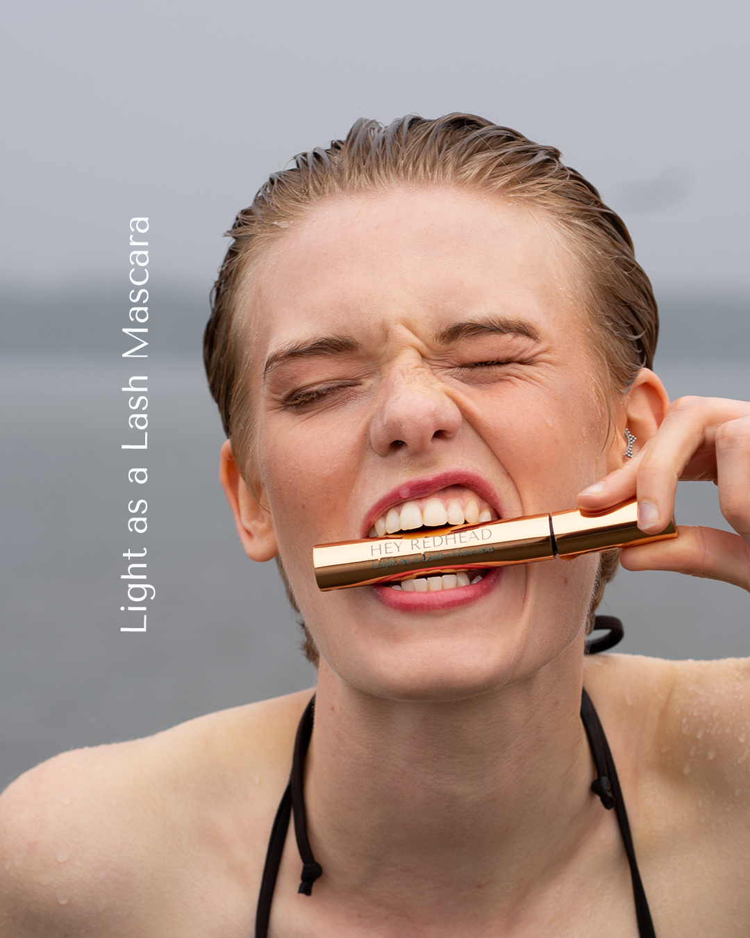 blond woman in the ocean with Light as a Lash mascara. Mascara for blondes and redheads.  