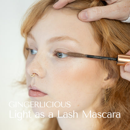 Nymph like model vith angel skin and strawberry blond hair wearing Gingerlicious Mascara. Light as a Lash Mascara. Hey Redhead. The Hey redhead mascaras fits fair lashes. Earthy, natural tones in mascara. 