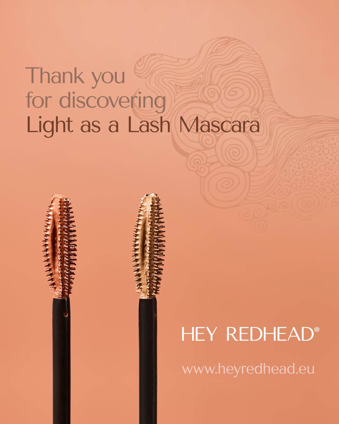Two mascara brushes with 'Hey Redhead' branding text on a peachy background. with illustration.