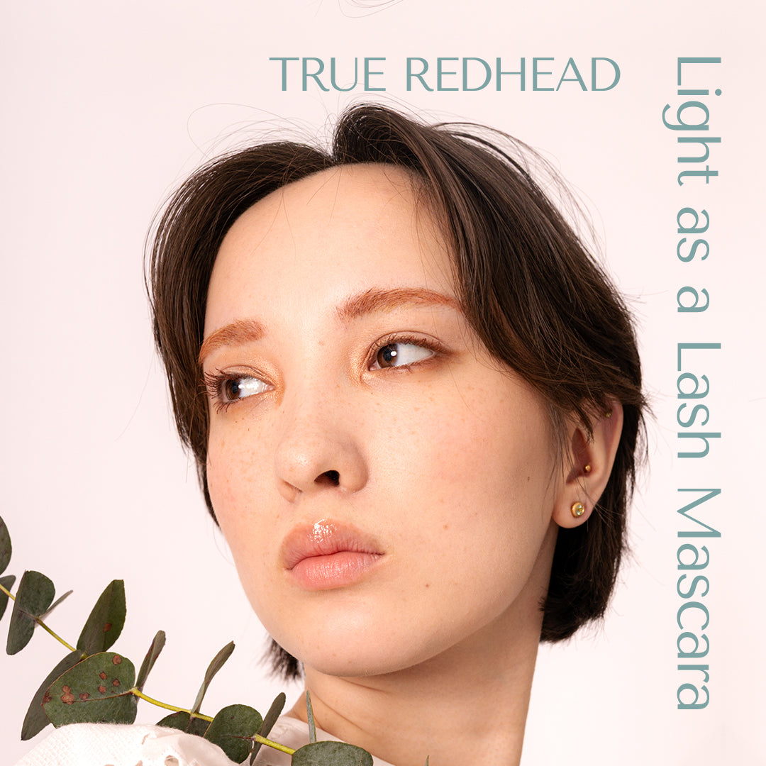 True redhead look great on brown eyes, blue eyes and green eyes. The model in the picture  displays light as a lash mascara from hey redhead. graphic design on the image. 