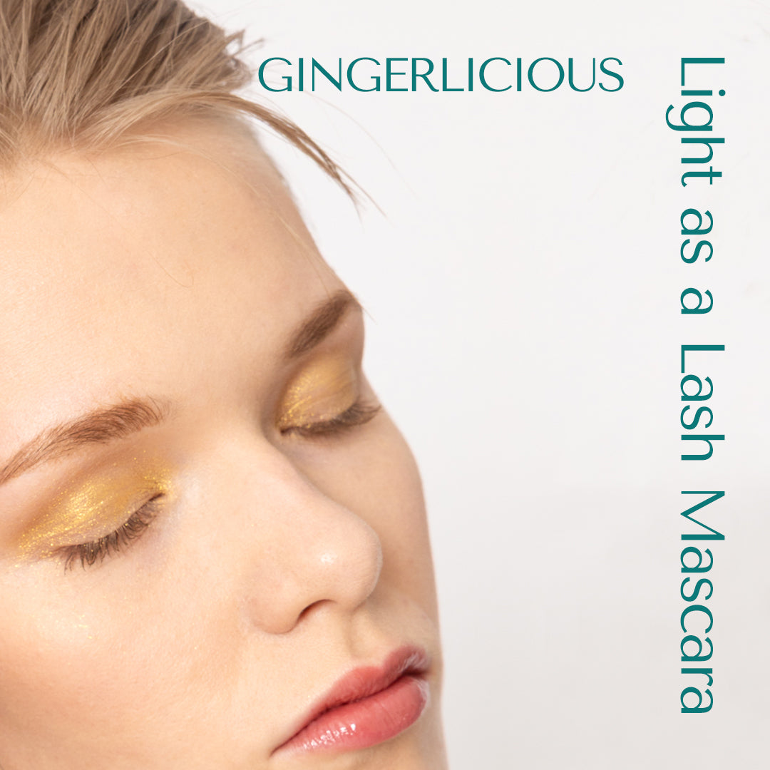 Ash blond lashes and brows styled with Light as a Lash Mascara in the shade Gingerlicious. From HEY REDHEAD. Closed eyes, dreamy look.  short hair.