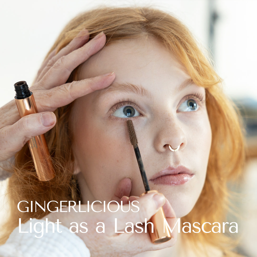 Fair Lashes and brows styled with Light as a Lash Mascara in the shade Gingerlicious. From HEY REDHEAD. Strawberry blonde model with nose ring. Professional make-up artist and mascara artist Eva reng-andersen applies mascara to female model. gorgina
