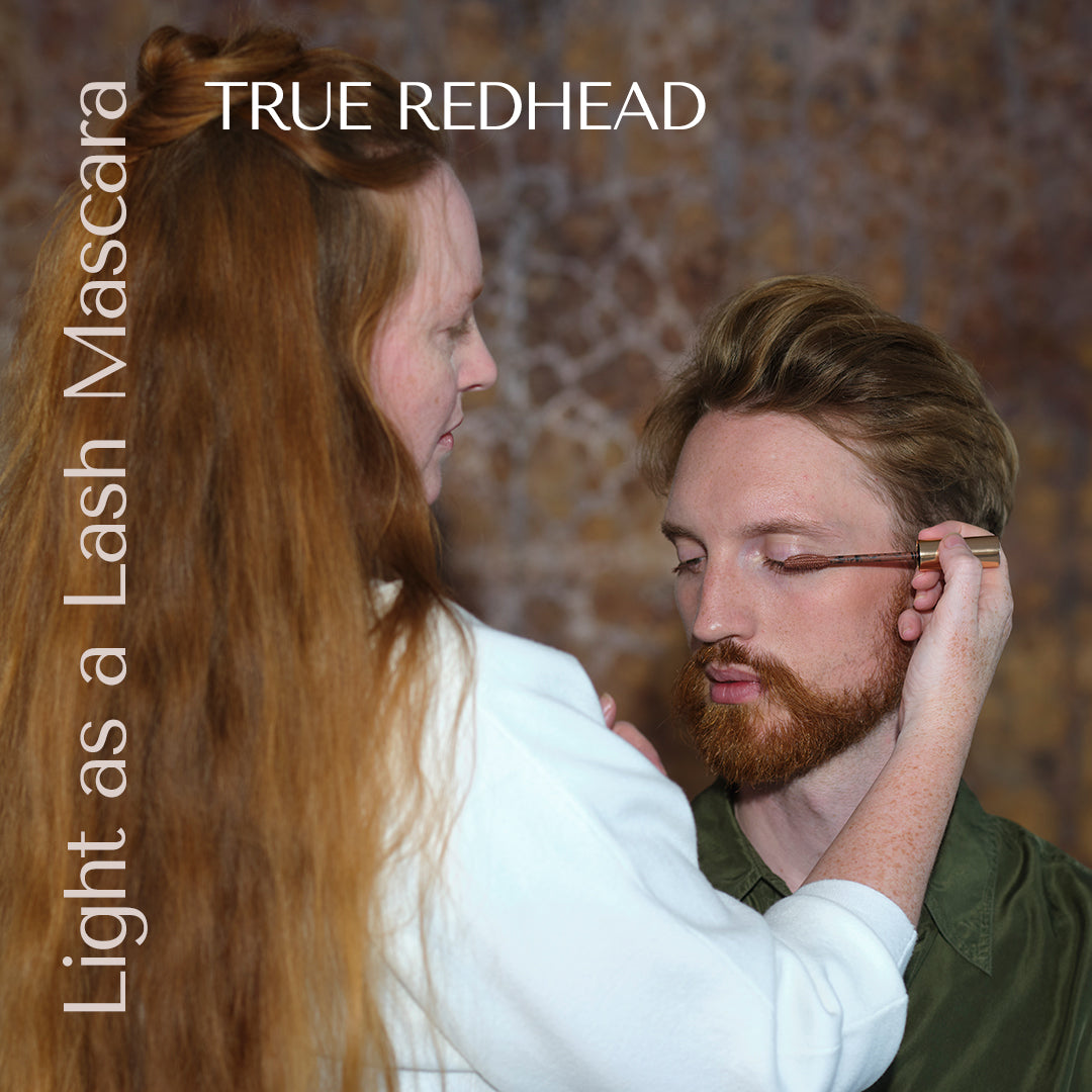 male hey redhead model christian and founder and make up artist eva reng-andersen. Eva applies mascara on christian in the shade true redhead. image by Birthe Vembye. 