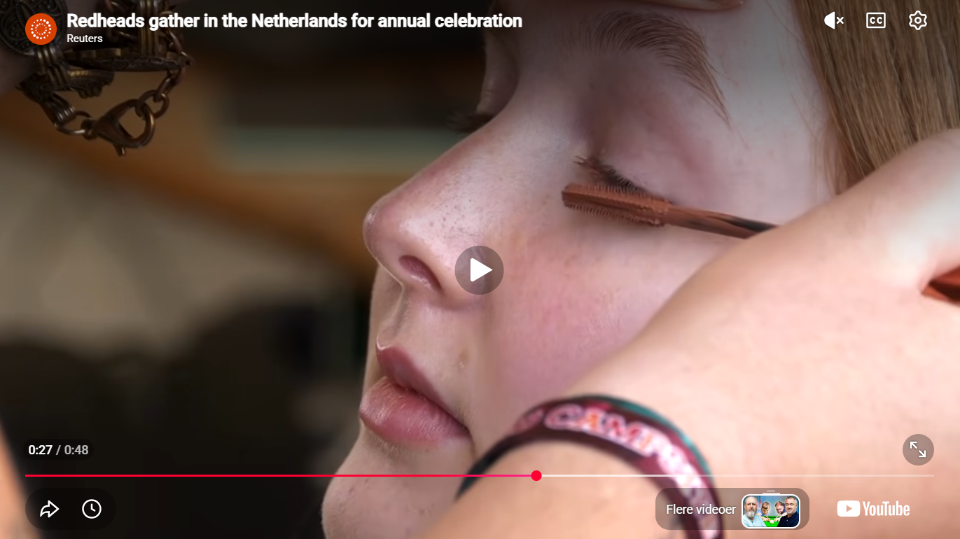 Load video: Red-haired people from all over the world gathered in the Dutch city of Tilburg for an annual gathering, Redhead Days 2026 edition. Participants paint, got photographed and sampled cosmetics brand for redheads HEY REDHEAD Mascara